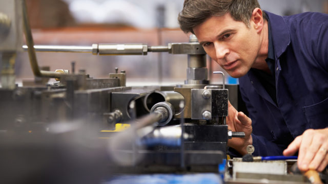 Engineer Looking at Machine
