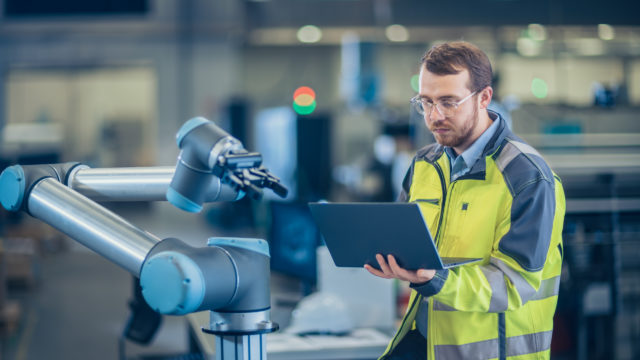 Health and safety man in hi-vis jacket with an ipad